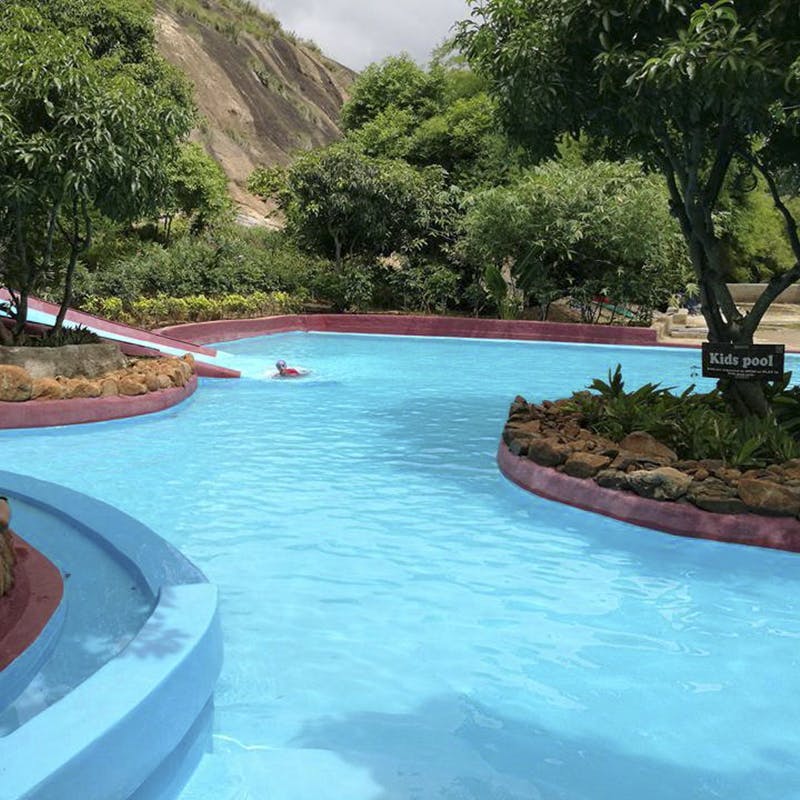 Swimming pool,Water,Natural landscape,Leisure,Vacation,Lagoon,Tropics,Resort,Tourism,Tree