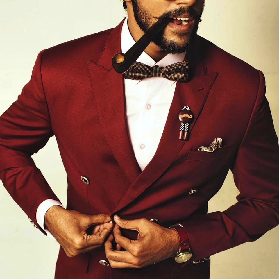 Suit,Formal wear,Clothing,Outerwear,Tuxedo,Facial hair,Gentleman,Blazer,Tie,Beard