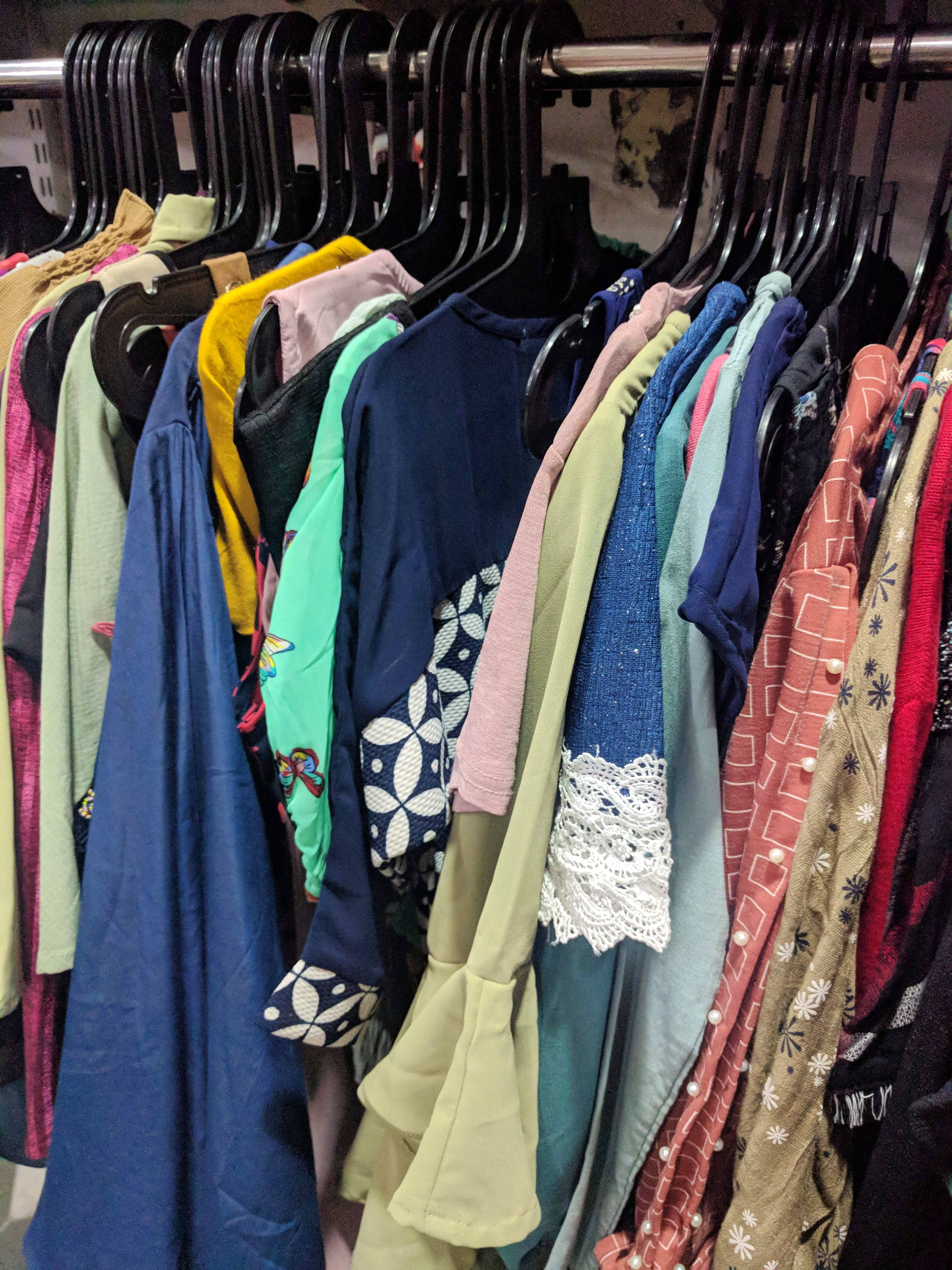 Clothing,Boutique,Clothes hanger,Room,Closet,Bazaar,Outerwear,Textile,Dress,Market