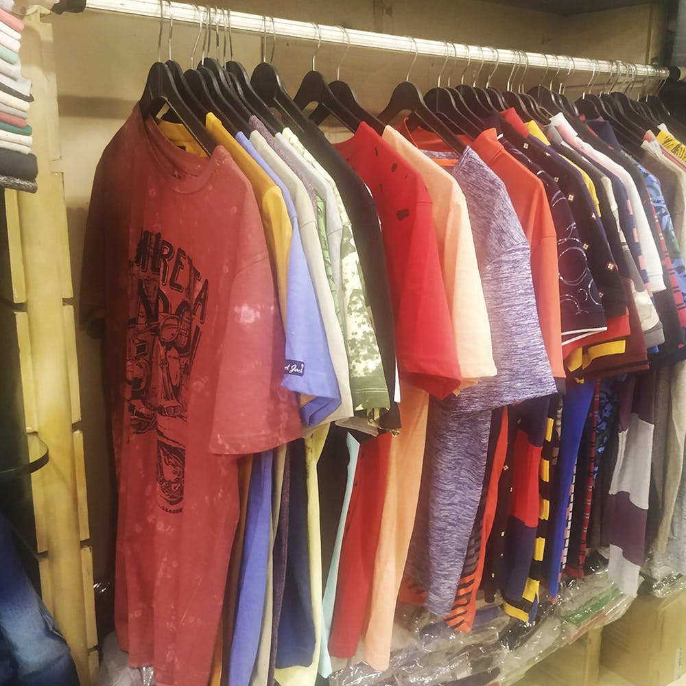 Boutique,Room,Outlet store,Textile,Closet,Wardrobe,Furniture,Clothes hanger,T-shirt