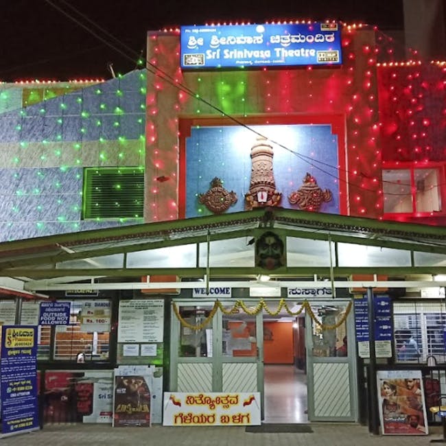 Building,Night,Electronic signage,Convenience store,Technology,Display device,Trade,Fast food restaurant,Signage