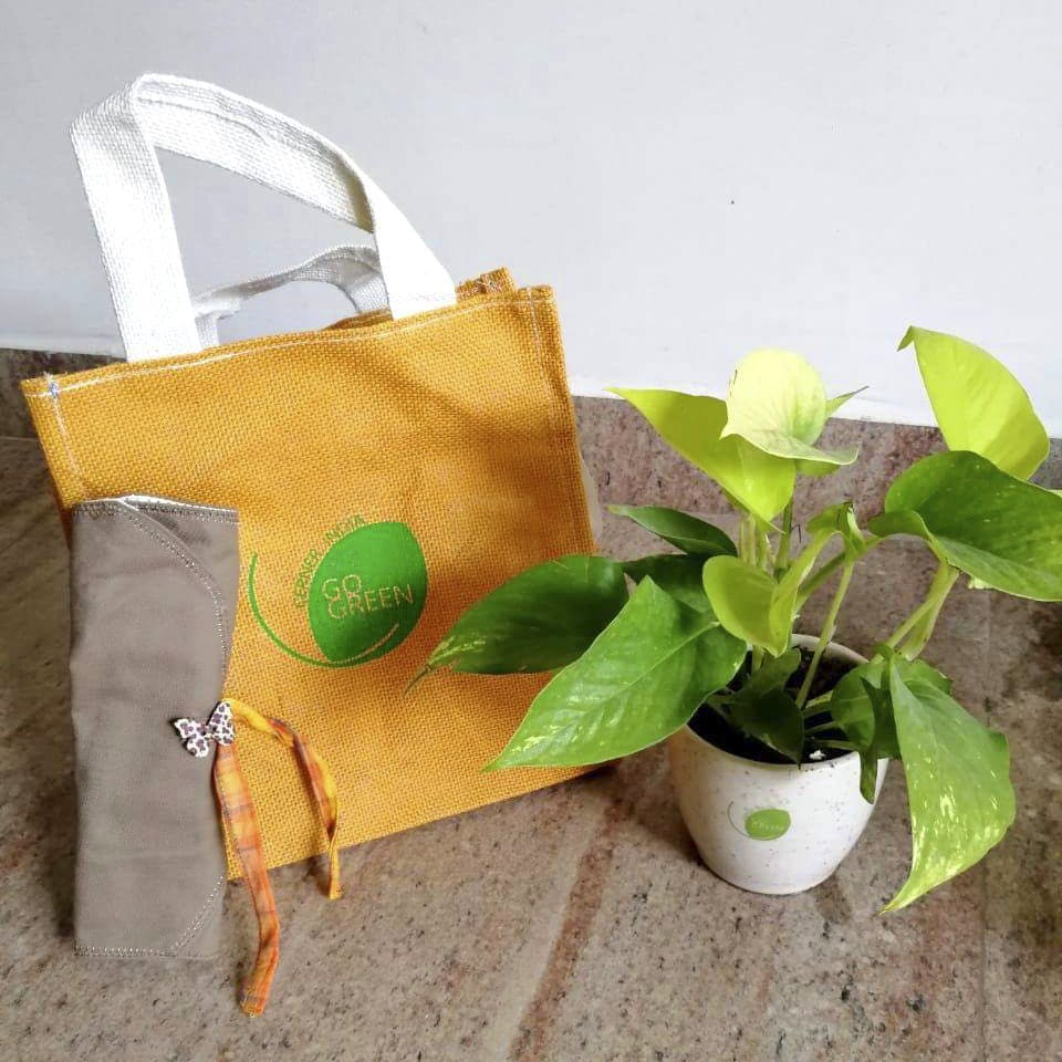 Bag,Shopping bag,Yellow,Paper bag,Plant,Handbag,Flower,Citrus,Packaging and labeling,Fashion accessory