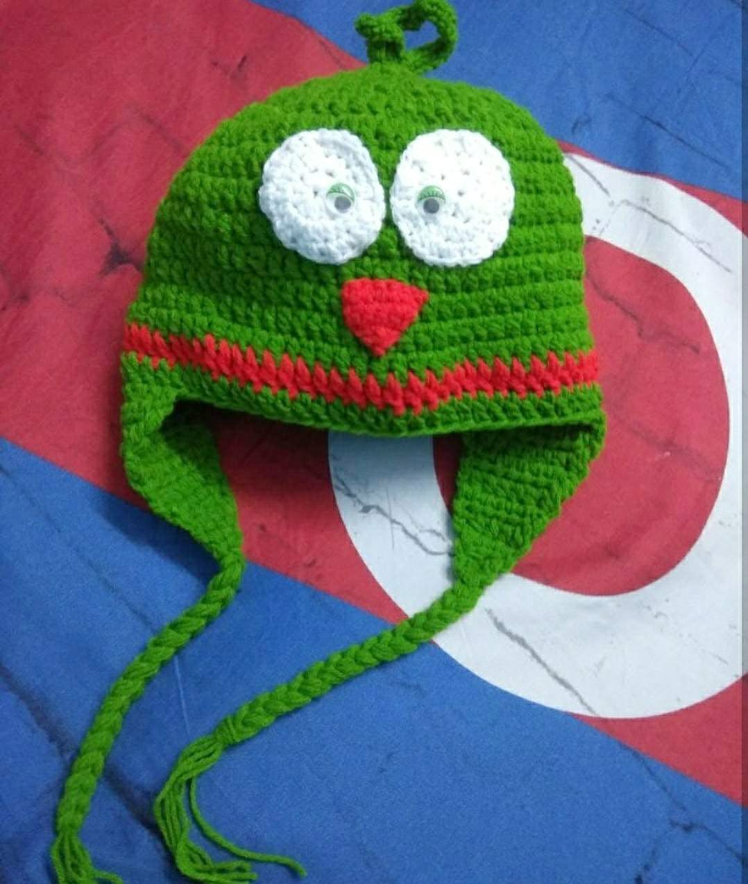 Green,Crochet,Cap,Knit cap,Headgear,Art,Textile,Beanie,Craft,Fictional character