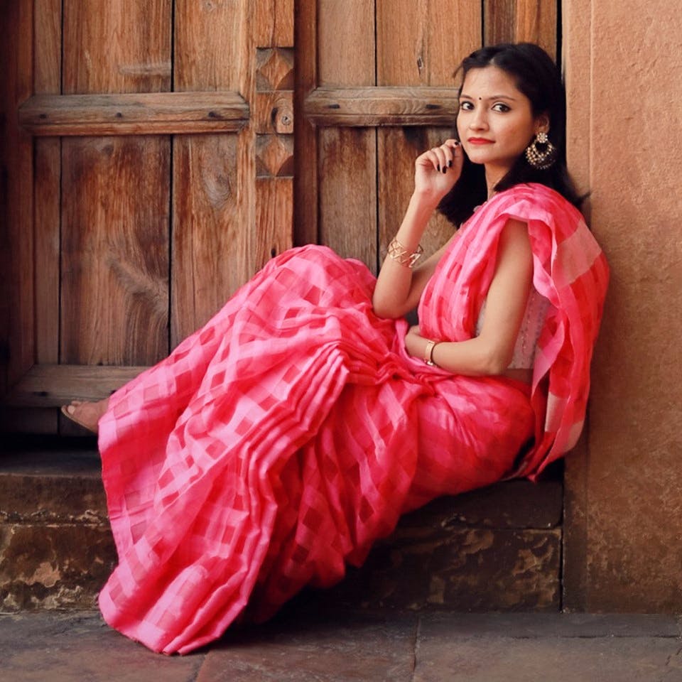 Bride dressed in red banarasi saree with dupatta on Craiyon