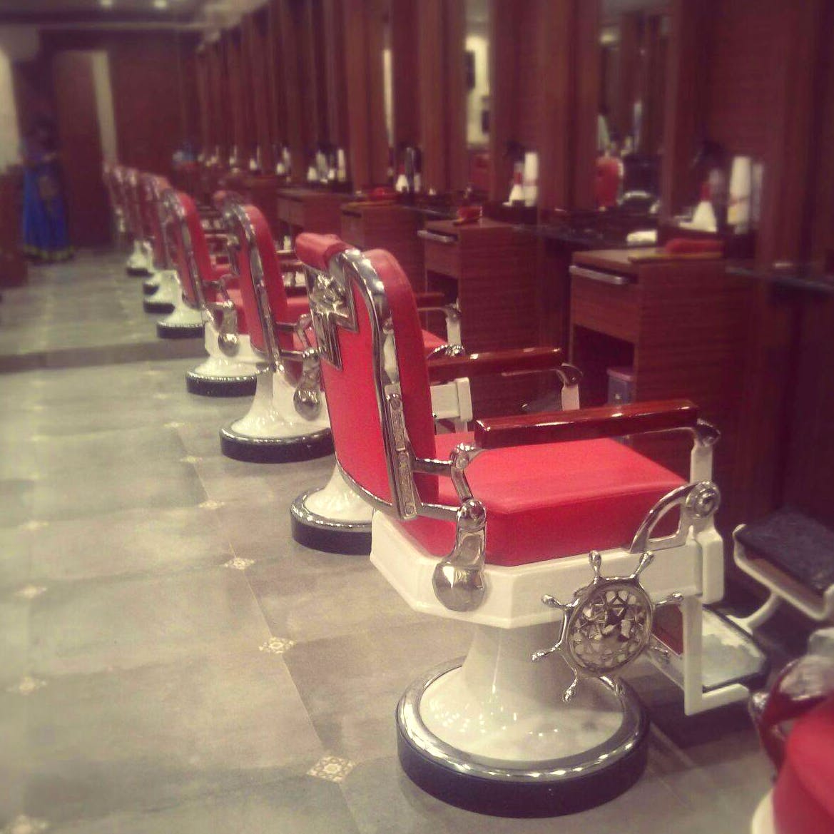 Red,Barber chair,Chair,Furniture,Floor,Material property,Machine,Room,Architecture,Table