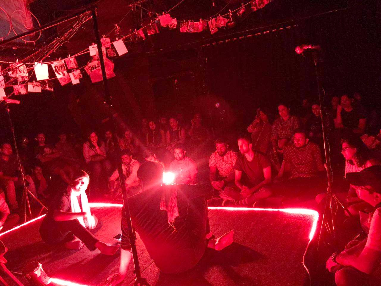 Red,Light,Event,Performance art,Performance,Music venue,Room,Crowd,Stage,Fête