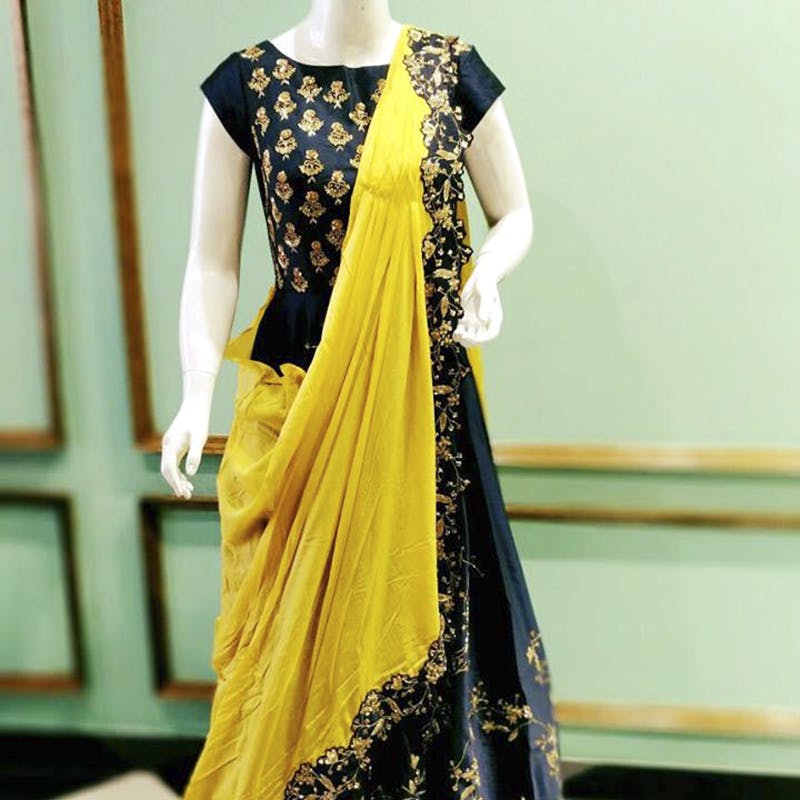 Clothing,Yellow,Formal wear,Dress,Sari,Fashion design,Textile,Fashion model,Embroidery