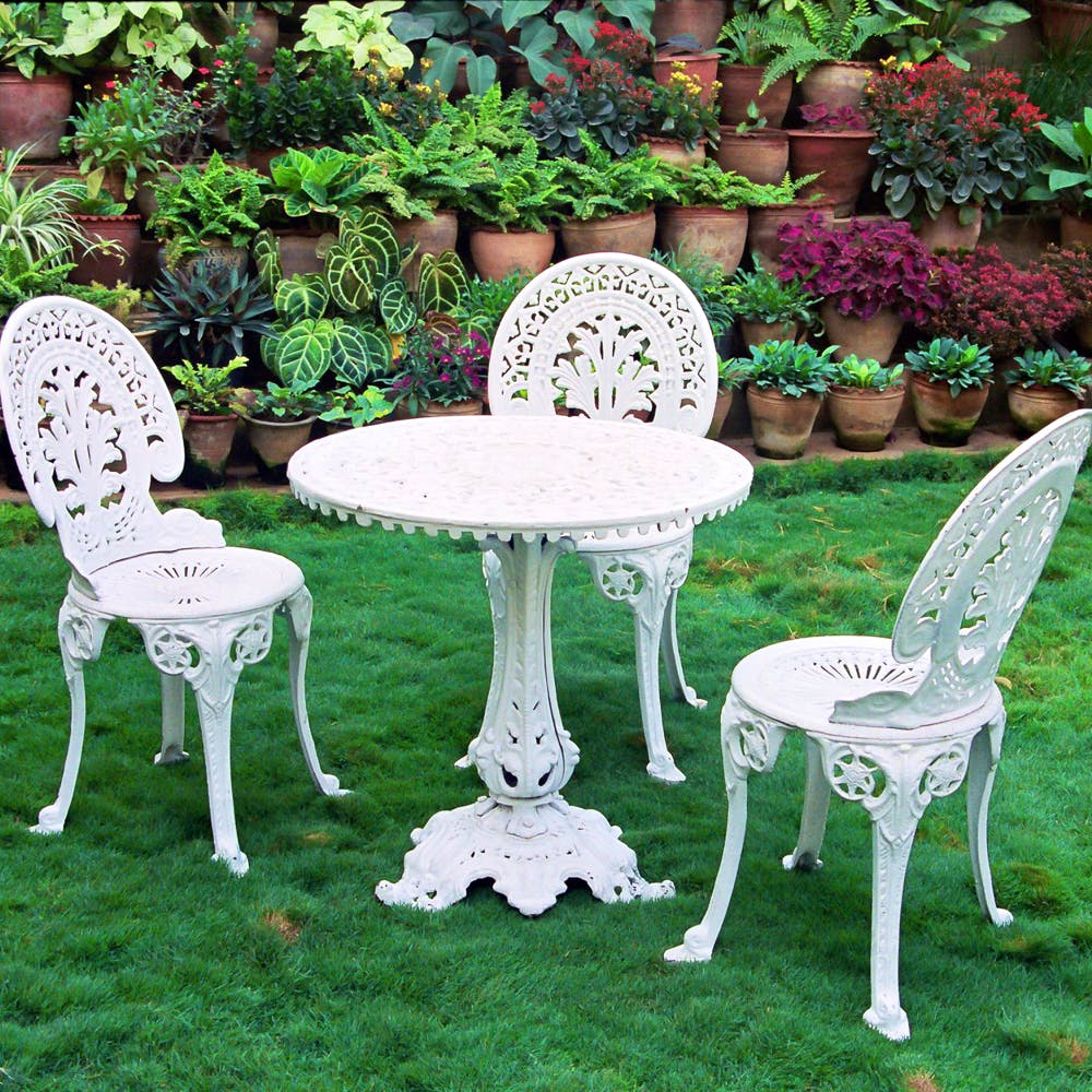 Furniture,Chair,Table,Outdoor table,Outdoor furniture,Iron,Grass family,Yard,Garden,Plant