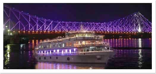 Luxury yacht,Purple,Violet,Landmark,Sport venue,Lighting,Night,Architecture,Light,Stadium