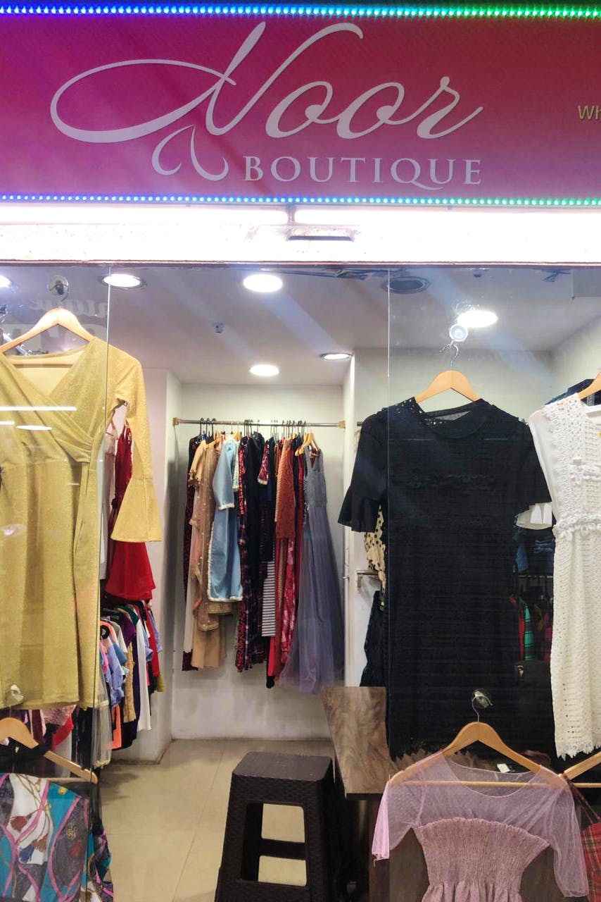 Boutique,Clothing,Outlet store,Retail,Room,Fashion,Building,Outerwear,Clothes hanger,Shopping