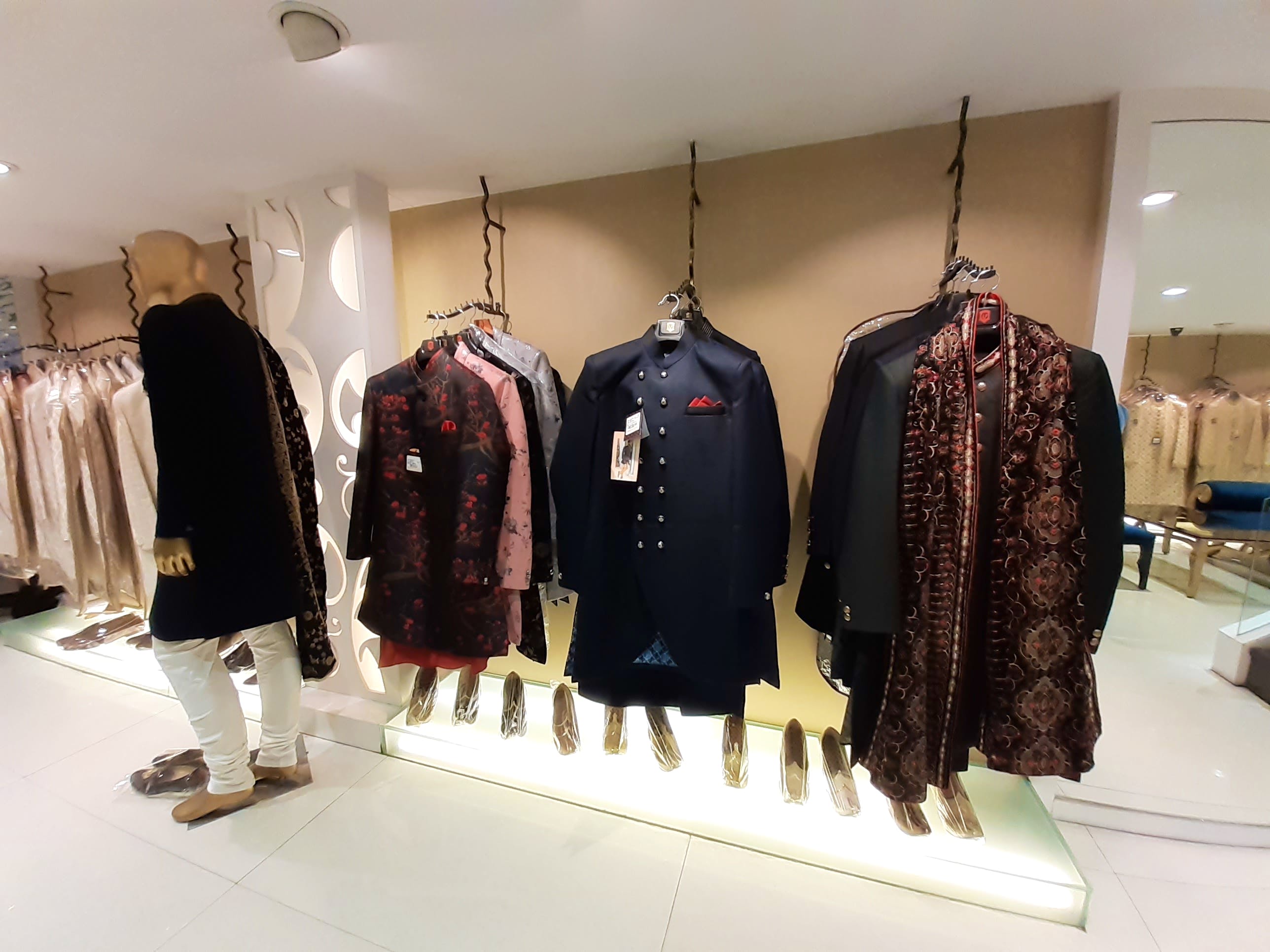 Boutique,Fashion,Outerwear,Clothes hanger,Fashion design,Display window,Footwear,Room,Retail,Collection