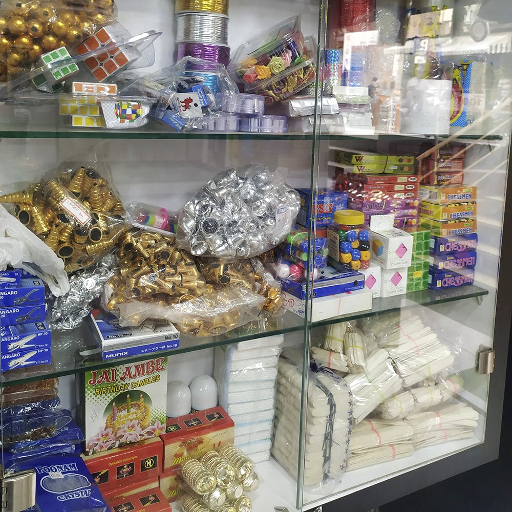 Snack,Convenience food,Plastic,Display case,Confectionery,Supermarket,Food,Toy,Convenience store,Grocery store