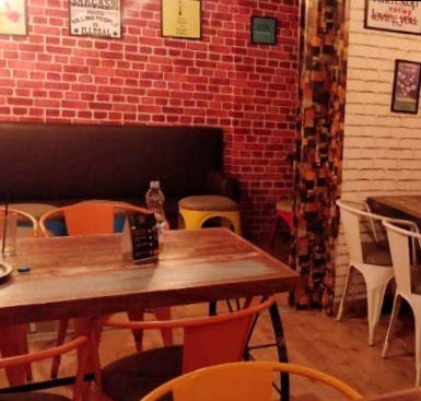 Restaurant,Brick,Room,Wall,Table,Interior design,Furniture,Building,House,Brickwork