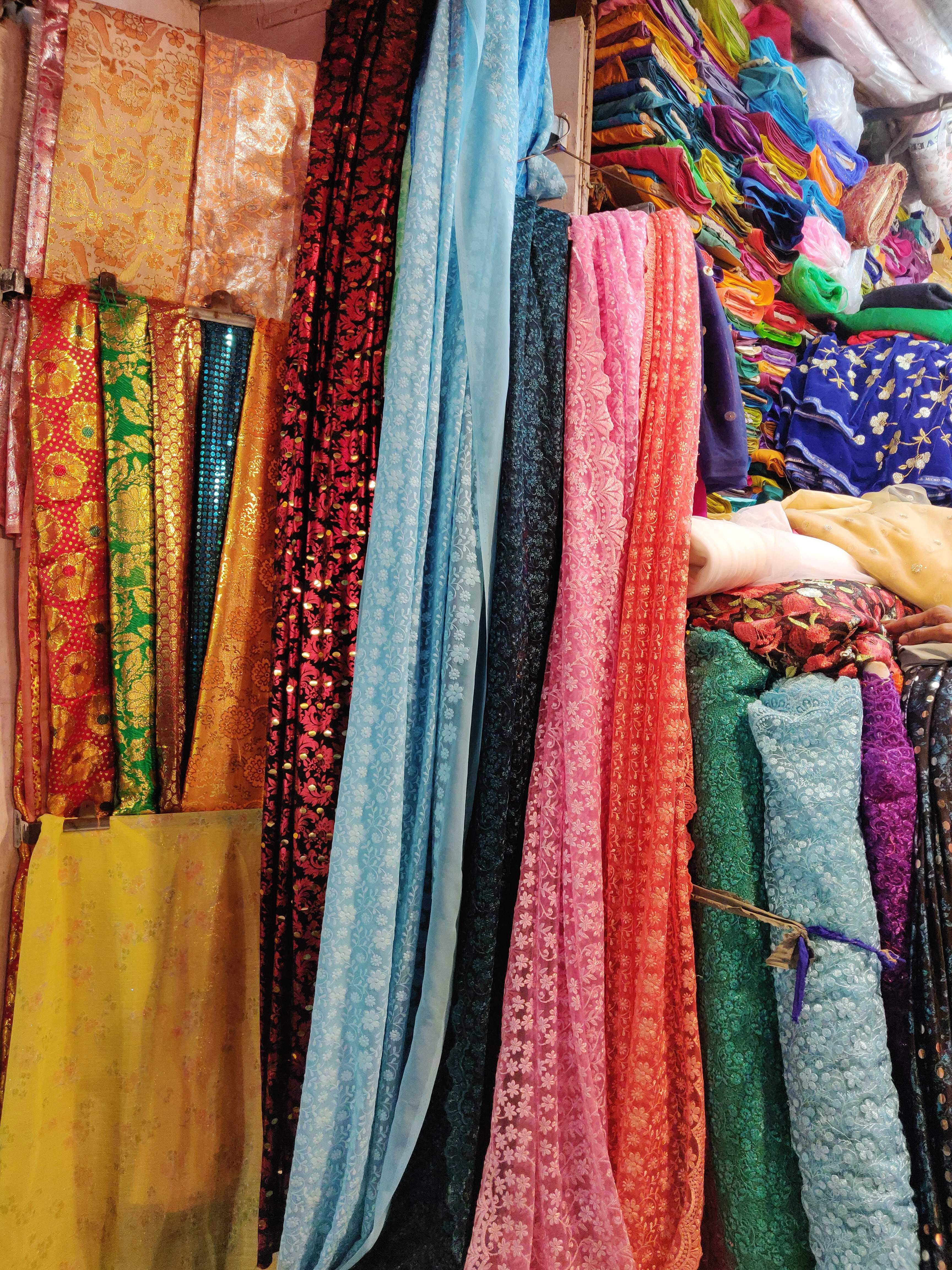 Clothing,Textile,Room,Woven fabric,Boutique,Bazaar,Market,Linens,Magenta,Sari