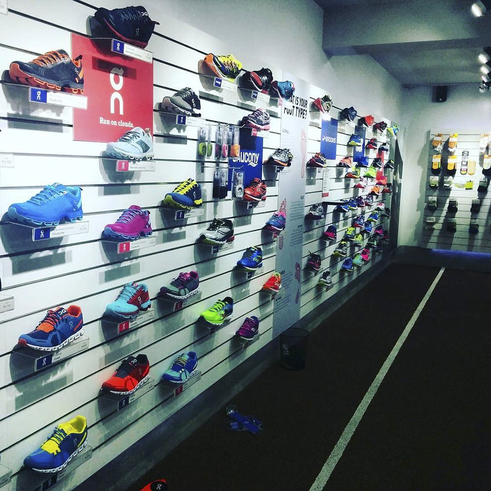 Footwear,Sportswear,Display case,Shelf,Shoe,Shoe store,Athletic shoe,Room,Architecture,Building