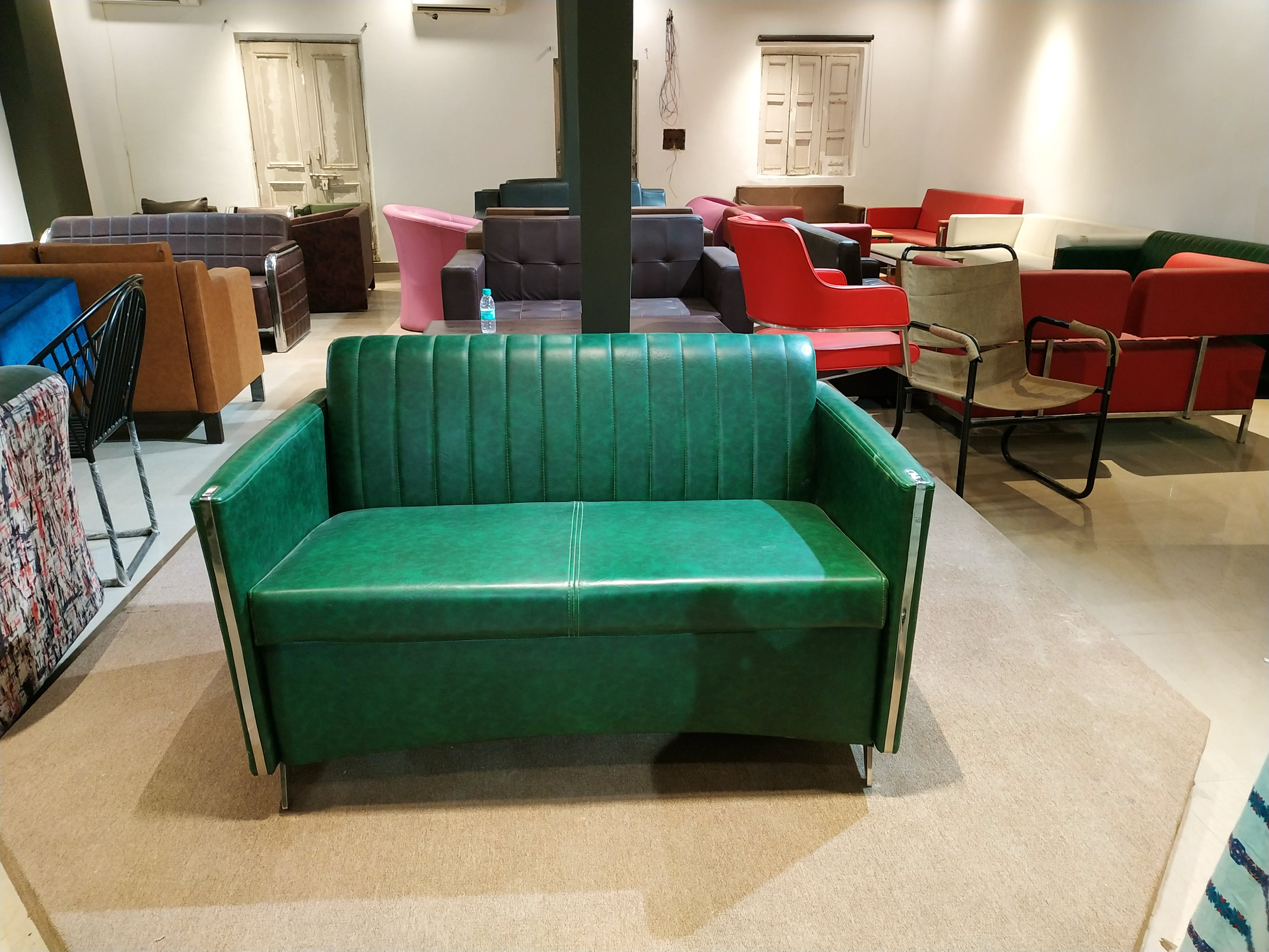Green,Furniture,Room,Property,Couch,Interior design,Table,Waiting room,Architecture,Floor