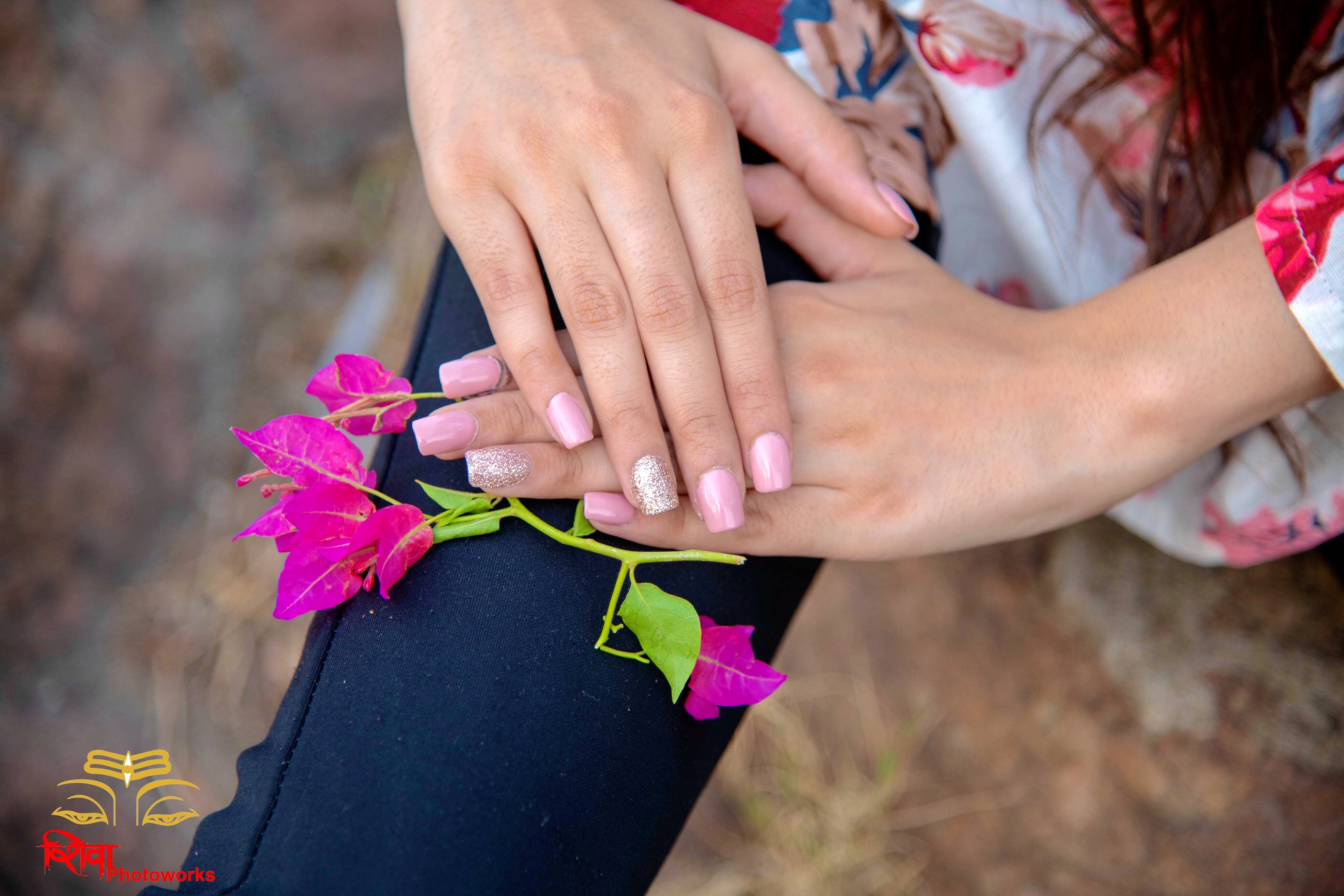 Nail,Pink,Flower,Hand,Finger,Plant,Floral design,Nail care,Magenta,Floristry