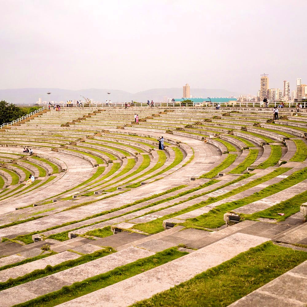 Grass,Landscape,Architecture,Urban design,Amphitheatre,Plant,Thoroughfare,Building,Sport venue,Race track