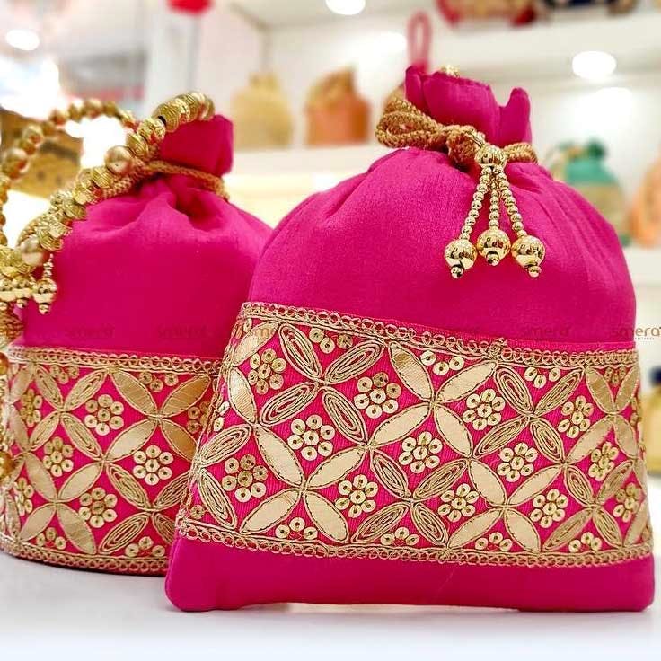 Pink,Bag,Fashion accessory,Handbag,Magenta,Coin purse,Font,Party favor,Keychain