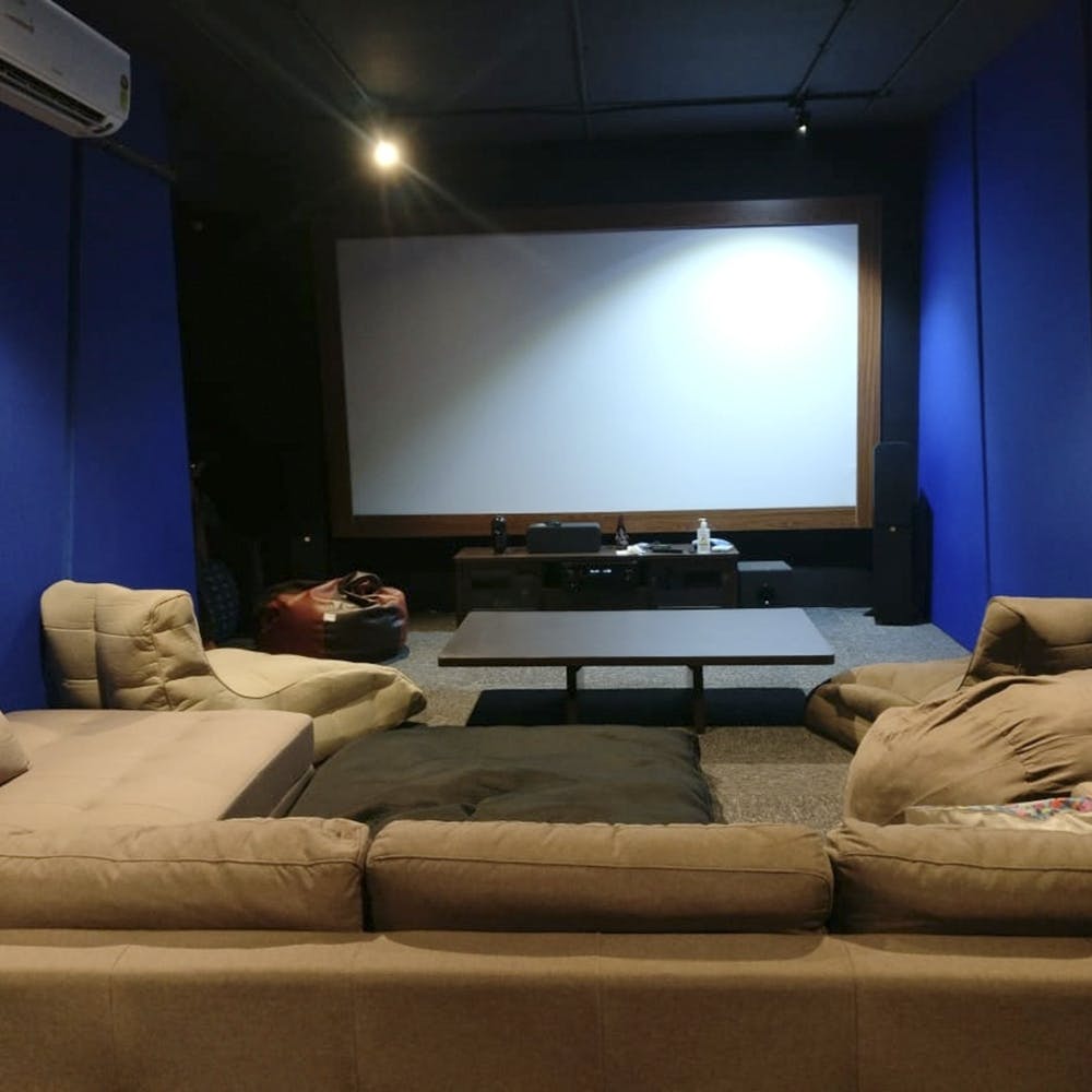 Room,Living room,Interior design,Home cinema,Furniture,Media,Flat panel display,Television,Technology,Electronic device