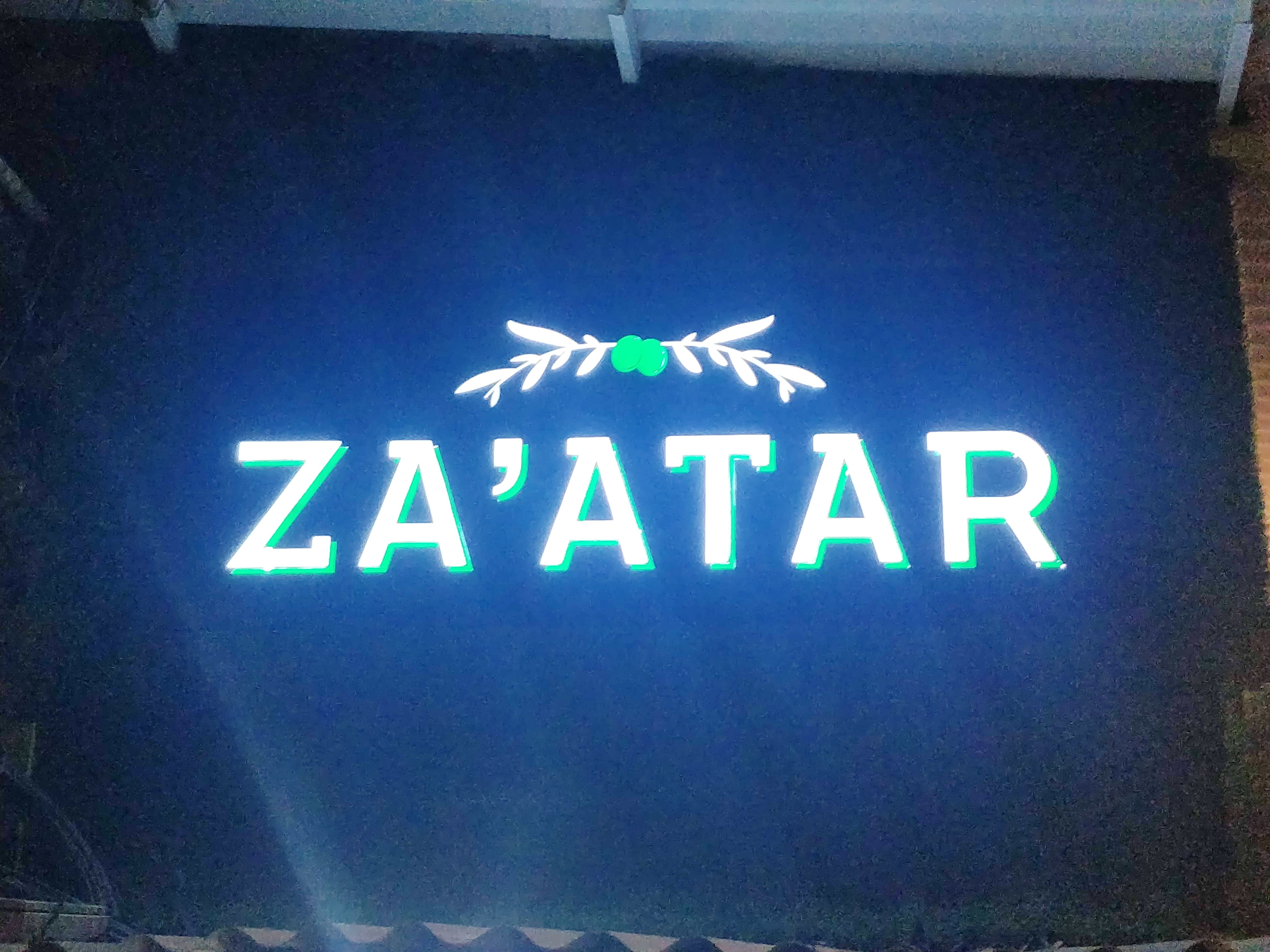 Green,Neon sign,Text,Signage,Font,Neon,Display device,Electronic signage,Technology,Logo