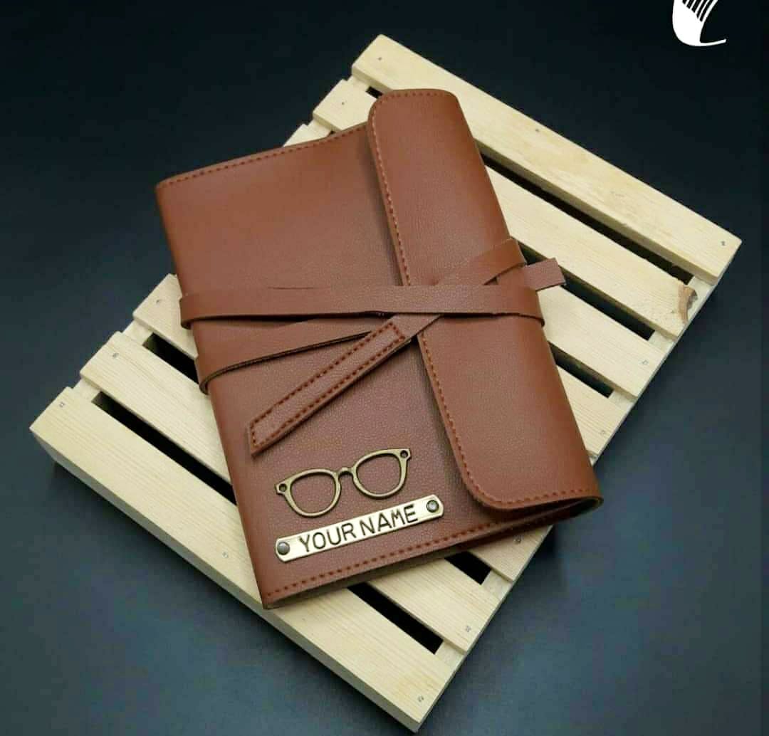 Wallet,Brown,Tan,Brand,Leather,Material property,Fashion accessory,Chocolate,Paper product,Paper