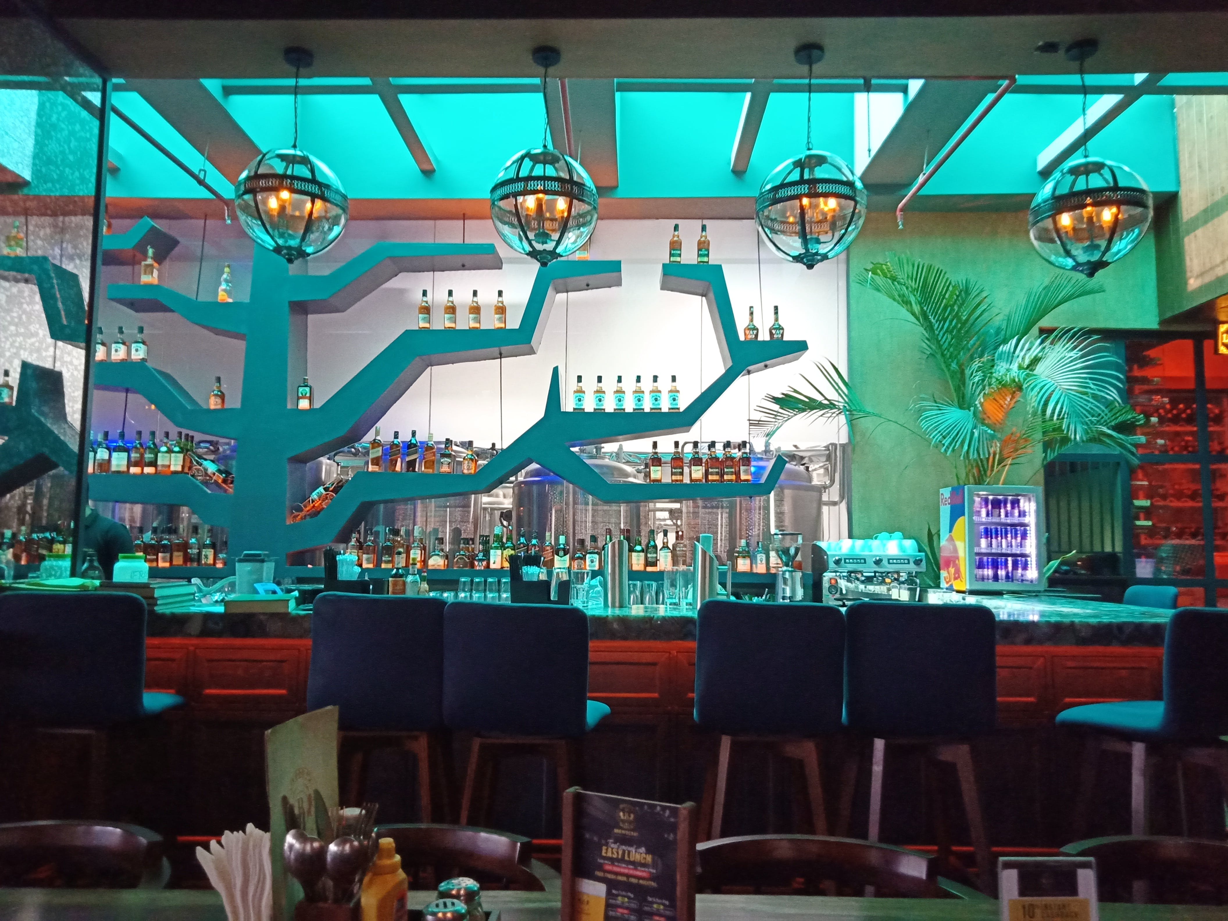 Turquoise,Restaurant,Bar,Room,Building,Interior design,Diner,Table,Leisure,Coffeehouse