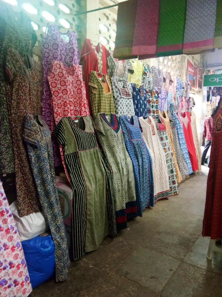 Bazaar,Market,Public space,Clothing,Boutique,Selling,Human settlement,Marketplace,Textile,Outlet store