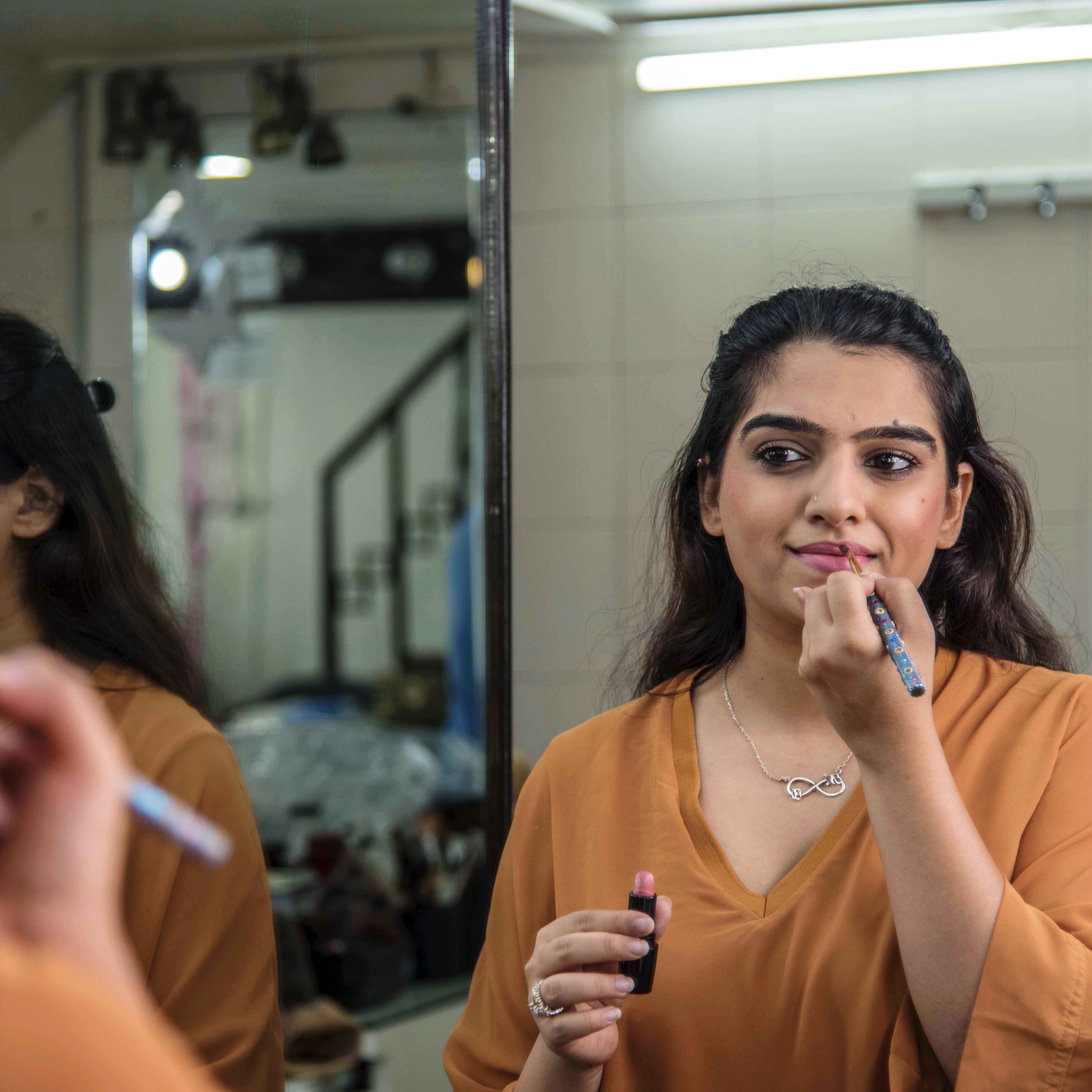 Lip,Beauty,Mouth,Nail,Room,Long hair,Finger,Tooth brushing,Eyelash,Reflection