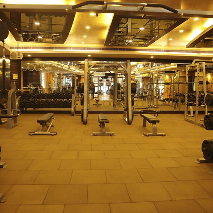 Building,Room,Lobby,Physical fitness,Flooring,Floor,Architecture,Interior design,Gym