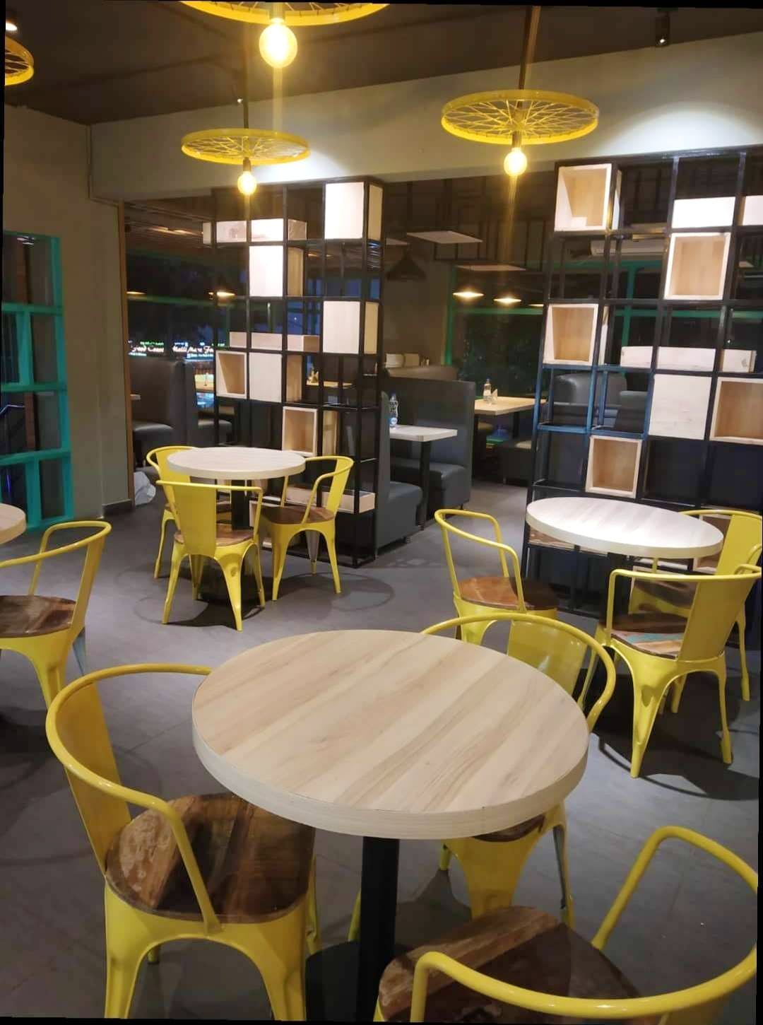 Room,Furniture,Table,Restaurant,Yellow,Cafeteria,Building,Café,Interior design,Coffeehouse