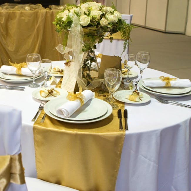 Wedding banquet,Decoration,Tablecloth,Yellow,Centrepiece,Table,Textile,Rehearsal dinner,Banquet,Tableware