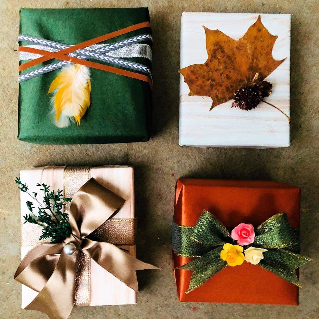 Leaf,Present,Gift wrapping,Paper,Plant,Twig,Paper product,Ribbon