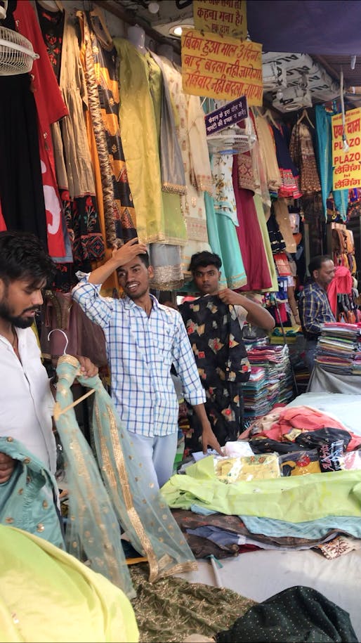 Selling,Bazaar,Market,Marketplace,Public space,Human settlement,Sari,Textile,Shopping,City