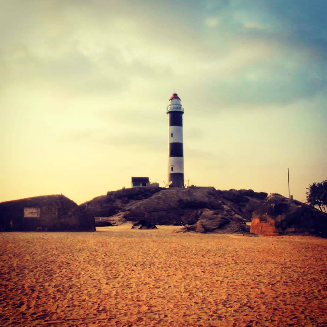 Sky,Lighthouse,Tower,Beacon,Landmark,Sea,Calm,Cloud,Horizon,Ocean