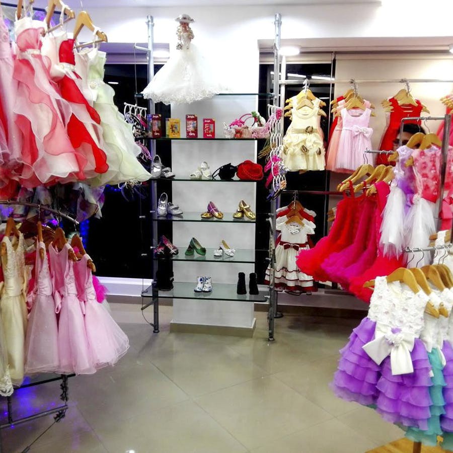Boutique,Pink,Clothing,Room,Dress,Fashion,Interior design,Magenta,Retail,Costume design