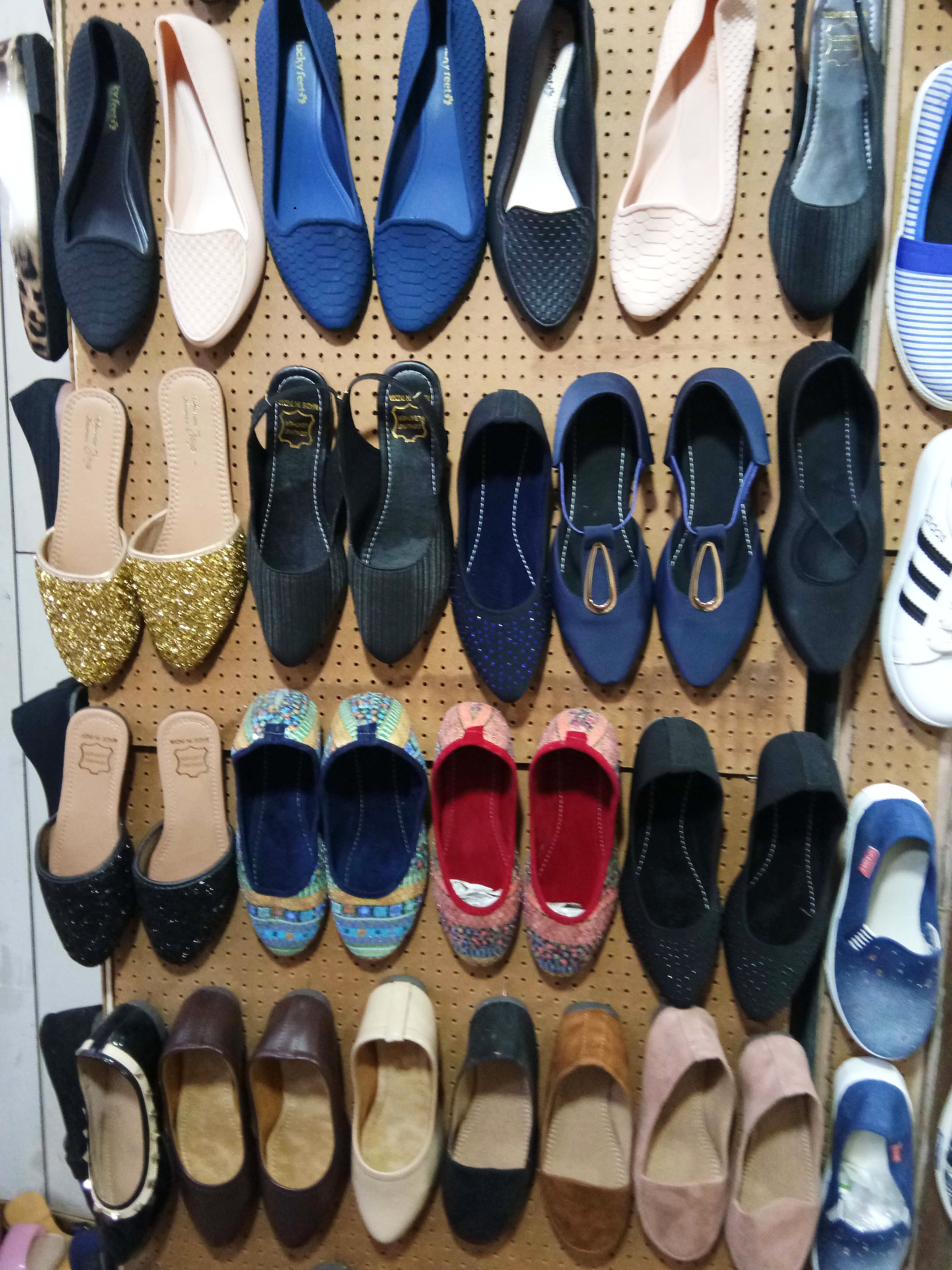 Footwear,Shoe,Plimsoll shoe,Slipper,Ballet flat,Collection,Shoe store,Sneakers,High heels,Athletic shoe