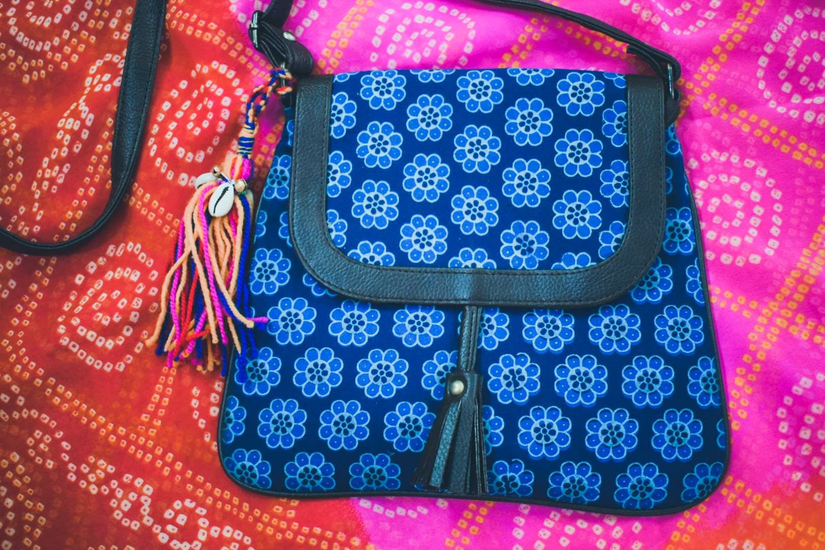 Bag,Handbag,Magenta,Shoulder bag,Fashion accessory,Pattern,Diaper bag,Visual arts,Pattern,Electric blue