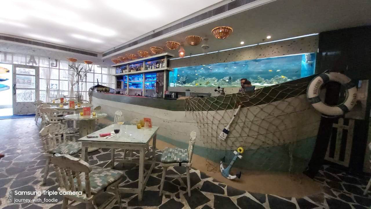 This Pretty Beach Themed Cafe Serving Delicious Sea Food | LBB