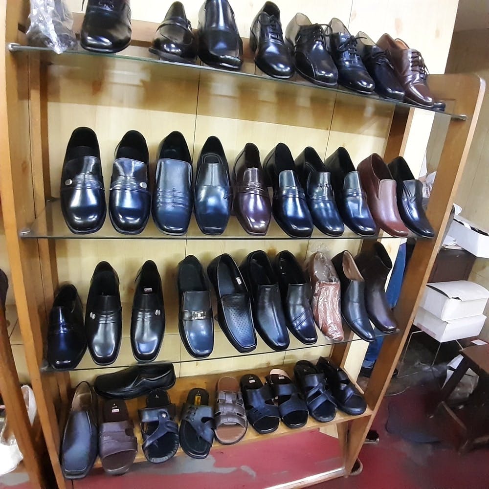 Footwear,Shoe store,Shoe,Collection,Shoe organizer,Shelf,Athletic shoe,Hiking boot