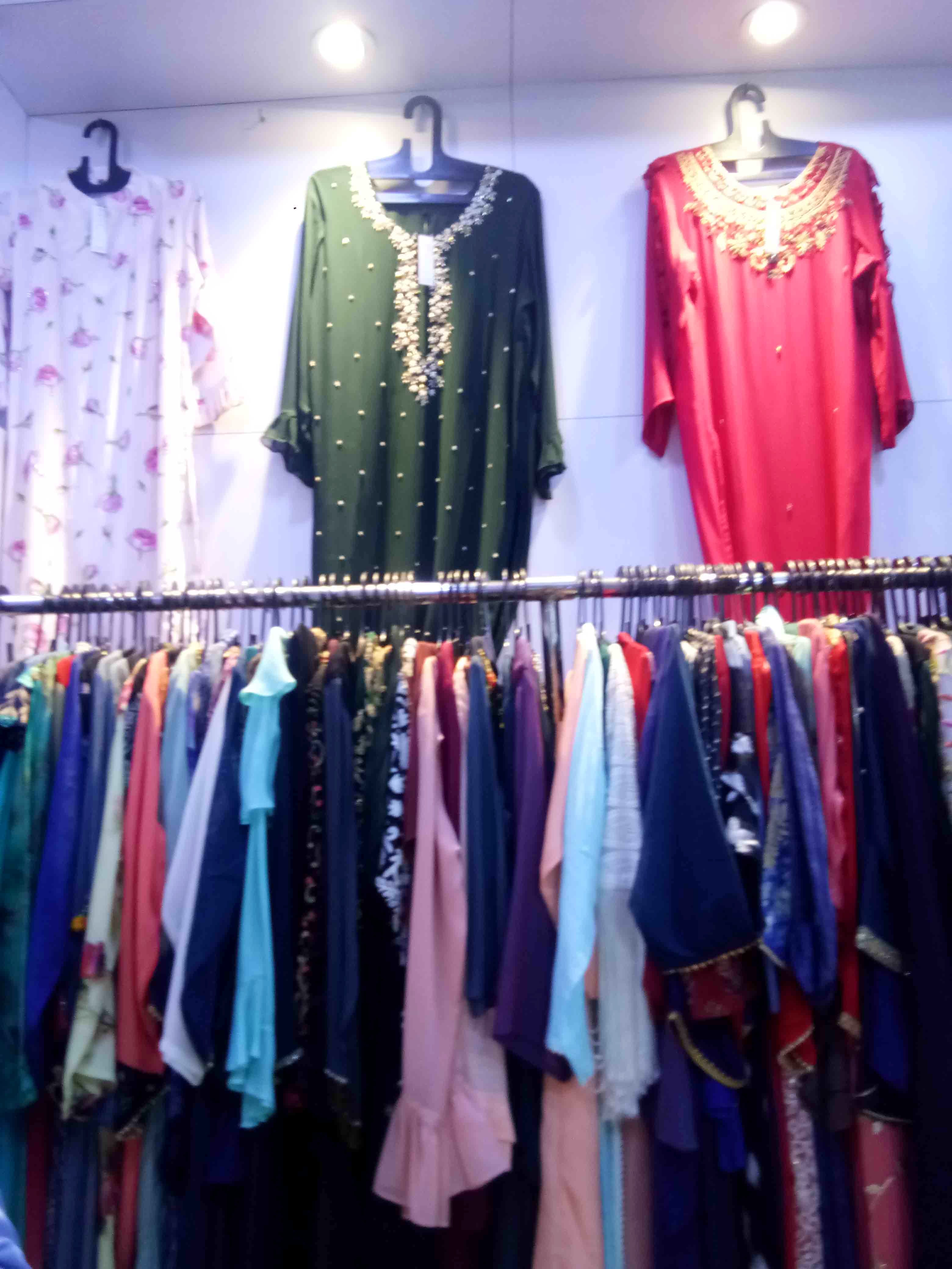 Boutique,Clothing,Clothes hanger,Dress,Room,Fashion,Outerwear,Textile,Outlet store,Retail