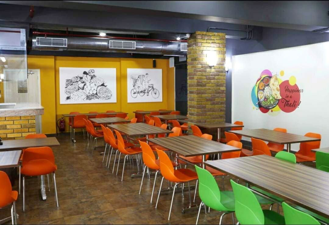 Room,Restaurant,Interior design,Building,Fast food restaurant,Table,Cafeteria,Food court,Café,Furniture