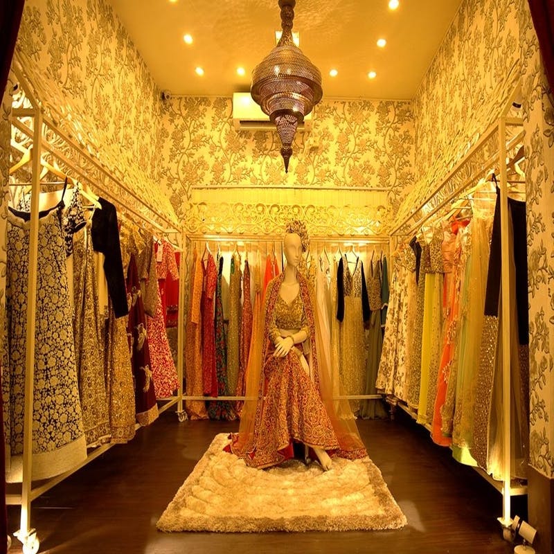 Decoration,Lighting,Dress,Room,Interior design,Yellow,Ceiling,Fashion,Light fixture,Textile