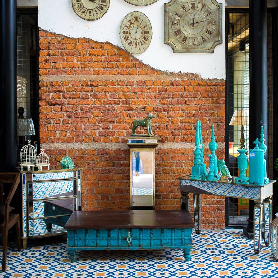 Blue,Turquoise,Room,Wall,Brick,Furniture,Interior design,Table,Brickwork,Building