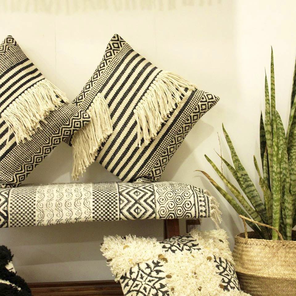 Room,Textile,Linens,Living room,Tablecloth,Cushion,Interior design,Furniture,Plant,Pillow