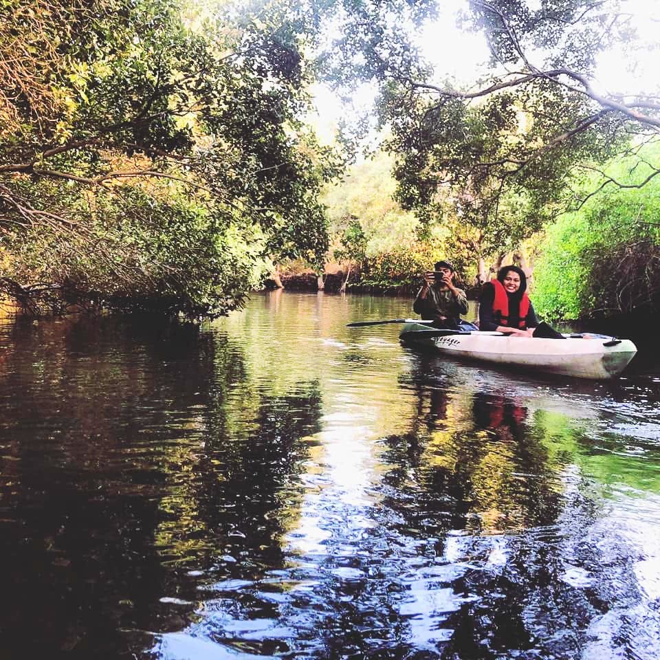 Water,Reflection,Waterway,River,Bayou,Sky,Wilderness,Natural environment,Boat,Bank