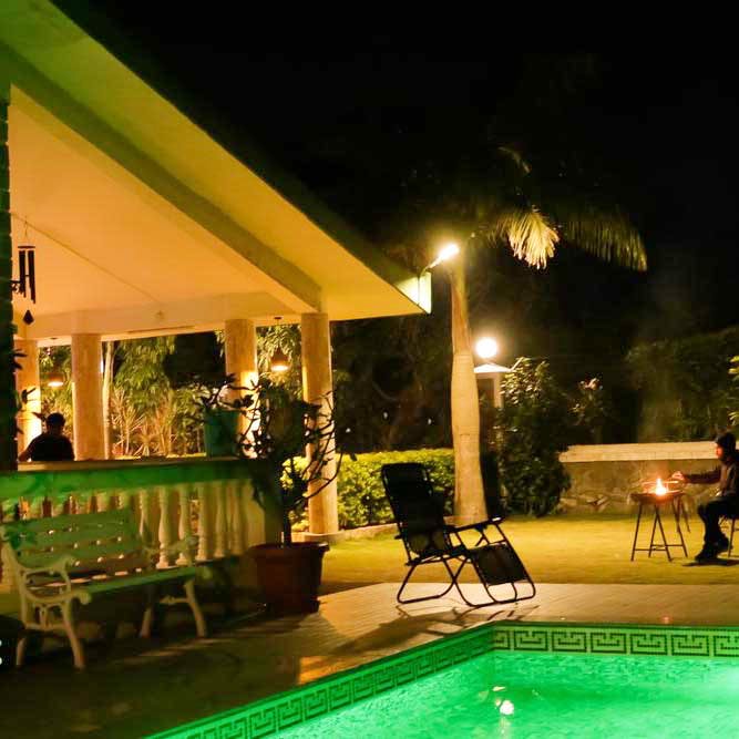 Property,Swimming pool,Lighting,Home,House,Leisure,Night,Resort,Landscape lighting,Backyard