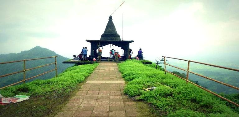 Sky,Atmospheric phenomenon,Tourism,Hill station,Cloud,Architecture,Vacation,Place of worship,Mountain,Building