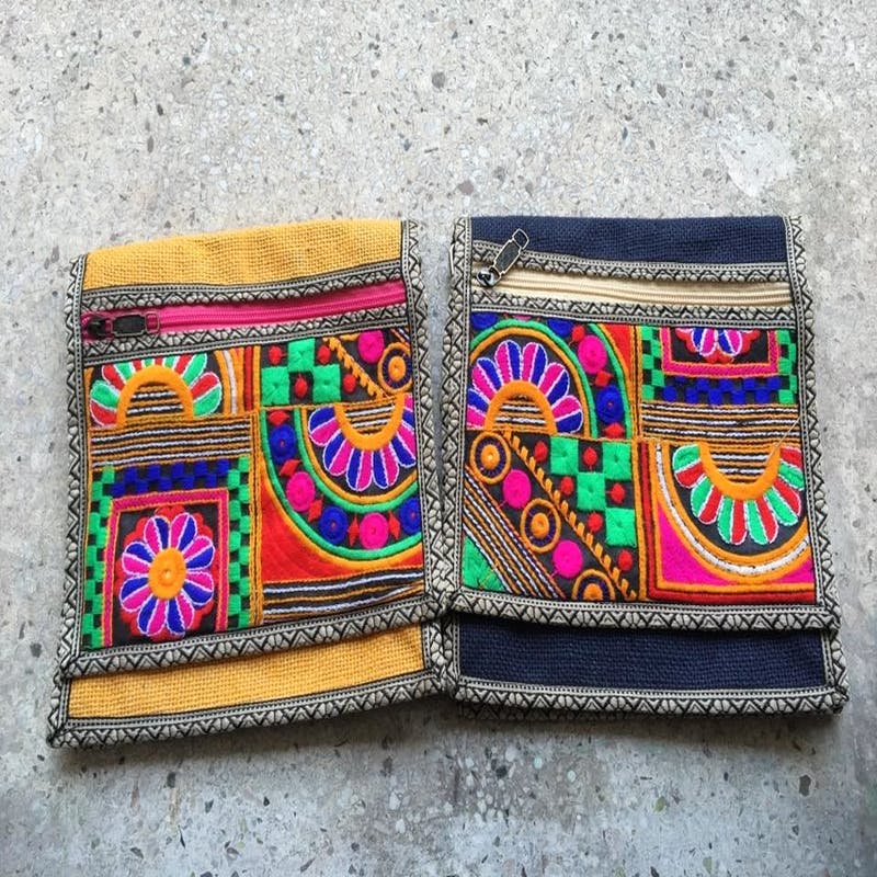 Wallet,Textile,Fashion accessory,Font,Visual arts,Pattern,Embroidery