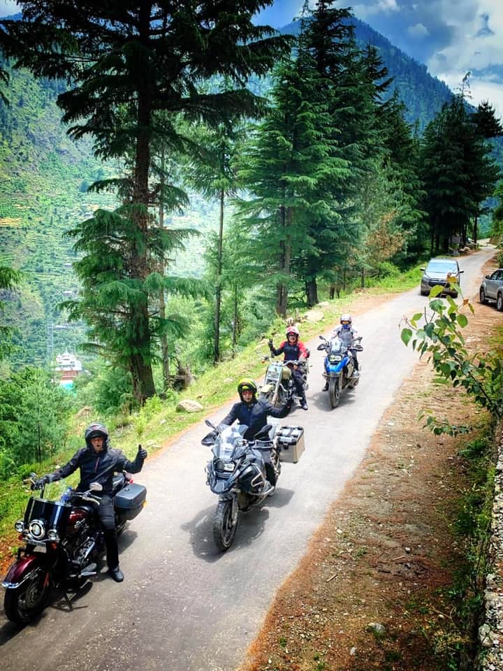 Vehicle,Motorcycle,Motorcycling,Mountain range,Adventure,Tree,Road,Trail,Thoroughfare,Mountain pass